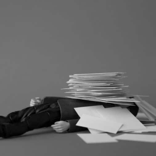 Buried under paperwork feature image